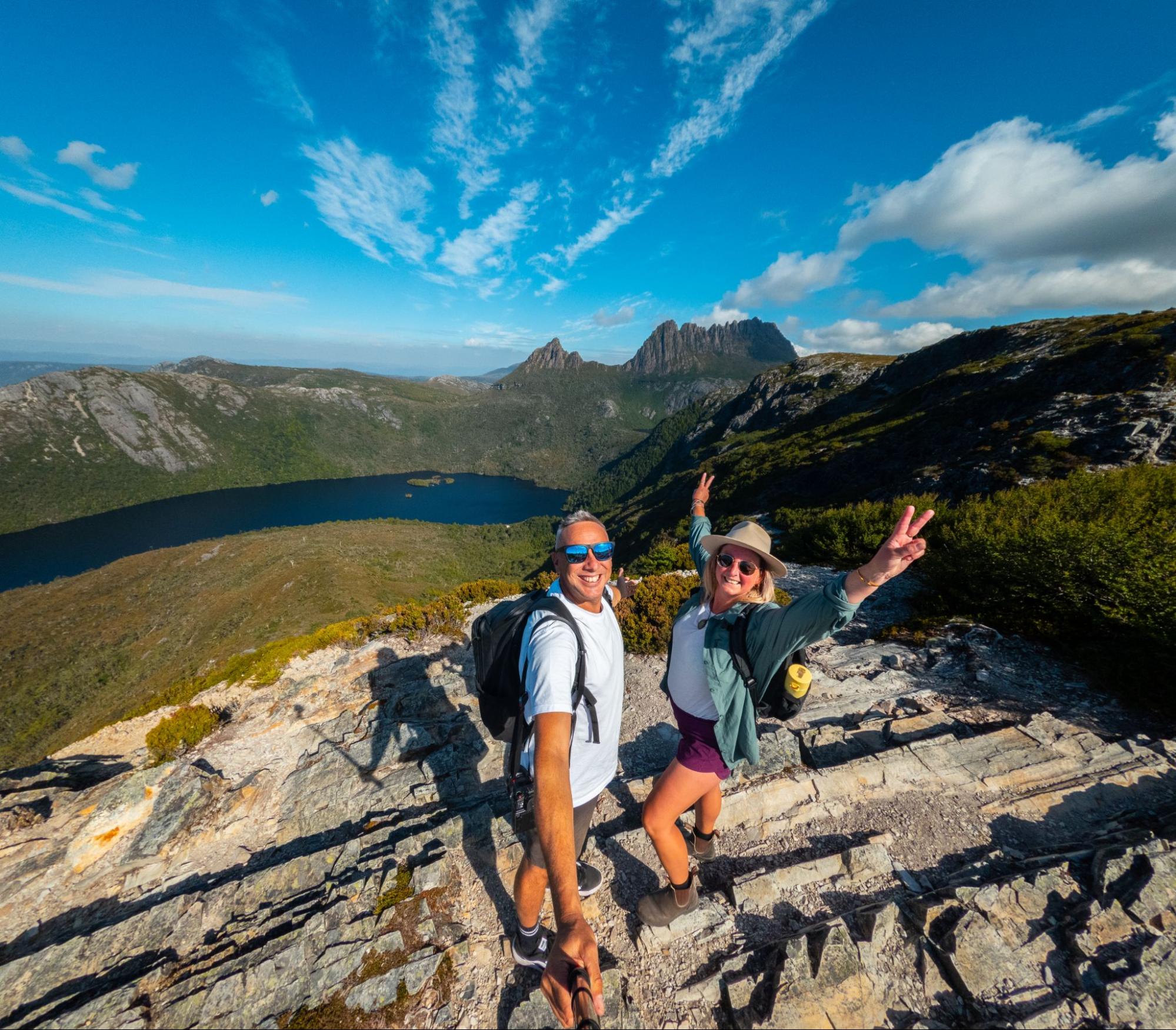 Hikers celebrating at mountain summit